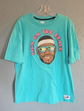 Nike Men’s Teal Graphic T-Shirt with Pink Lettering